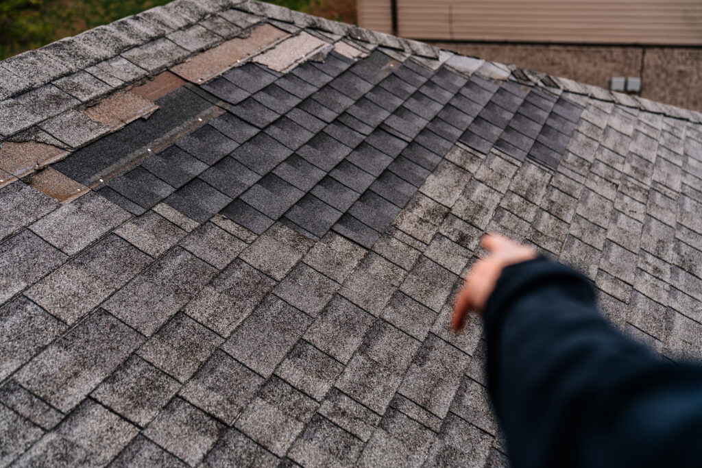 Damaged roof shingles needing repair