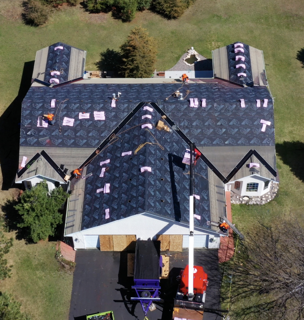 Aerial view of house roof under construction.